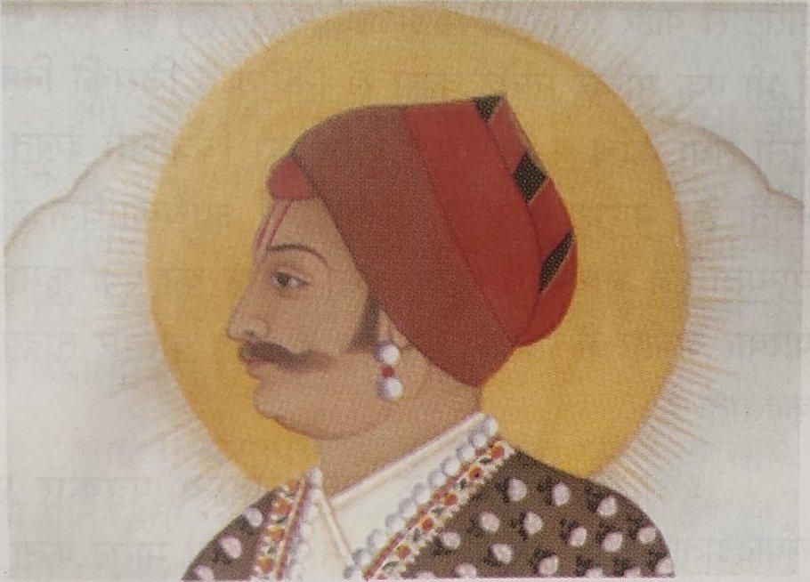 Jaipur-style miniature portrait of a man in a red turban against a golden halo